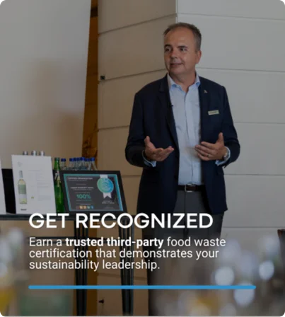 General hotel manager presenting food waste certification to journalists at a press event